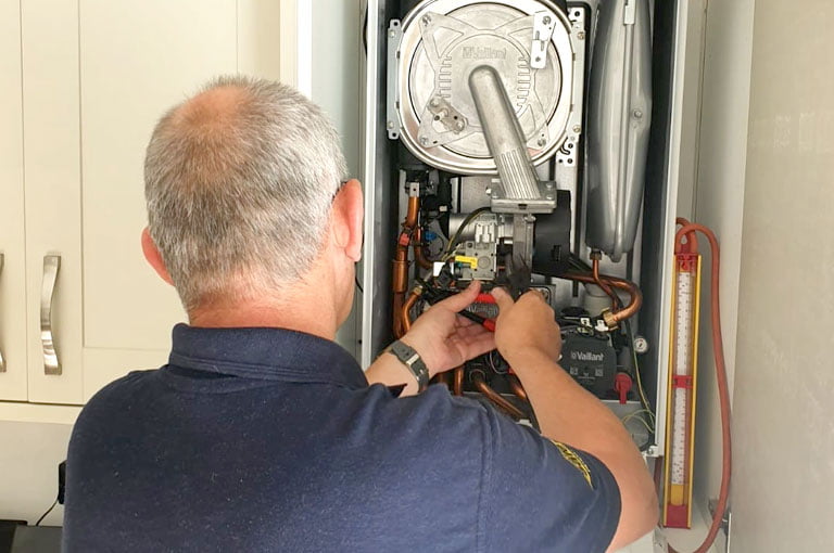 Brett Carey Working On a Boiler