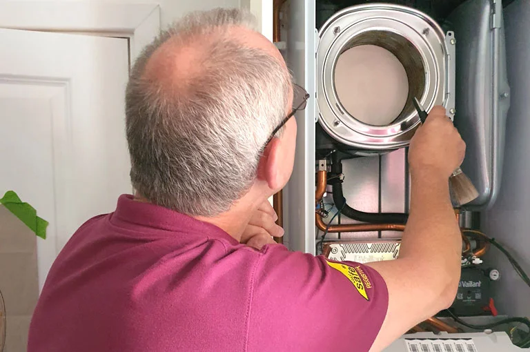 Brett Carey Working On a Boiler