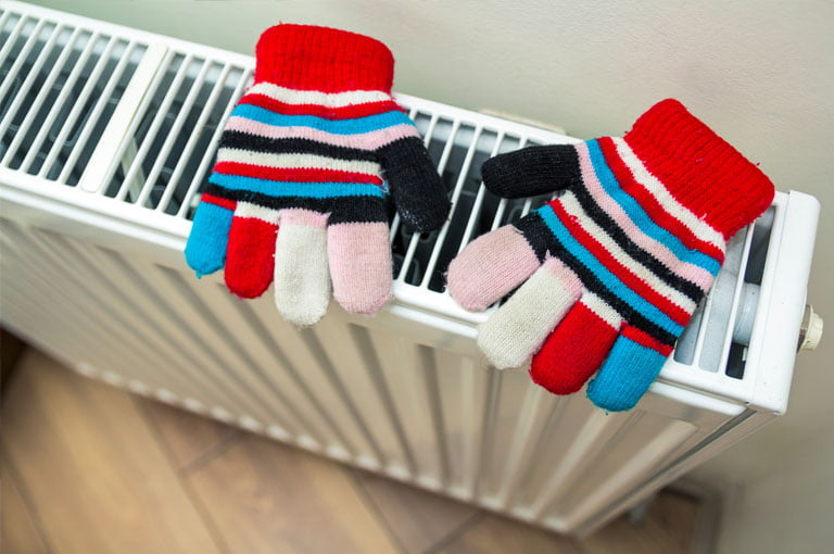 Gloves Drying on a Radiator