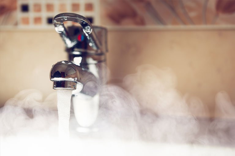 A Tap Sourounded By Steam